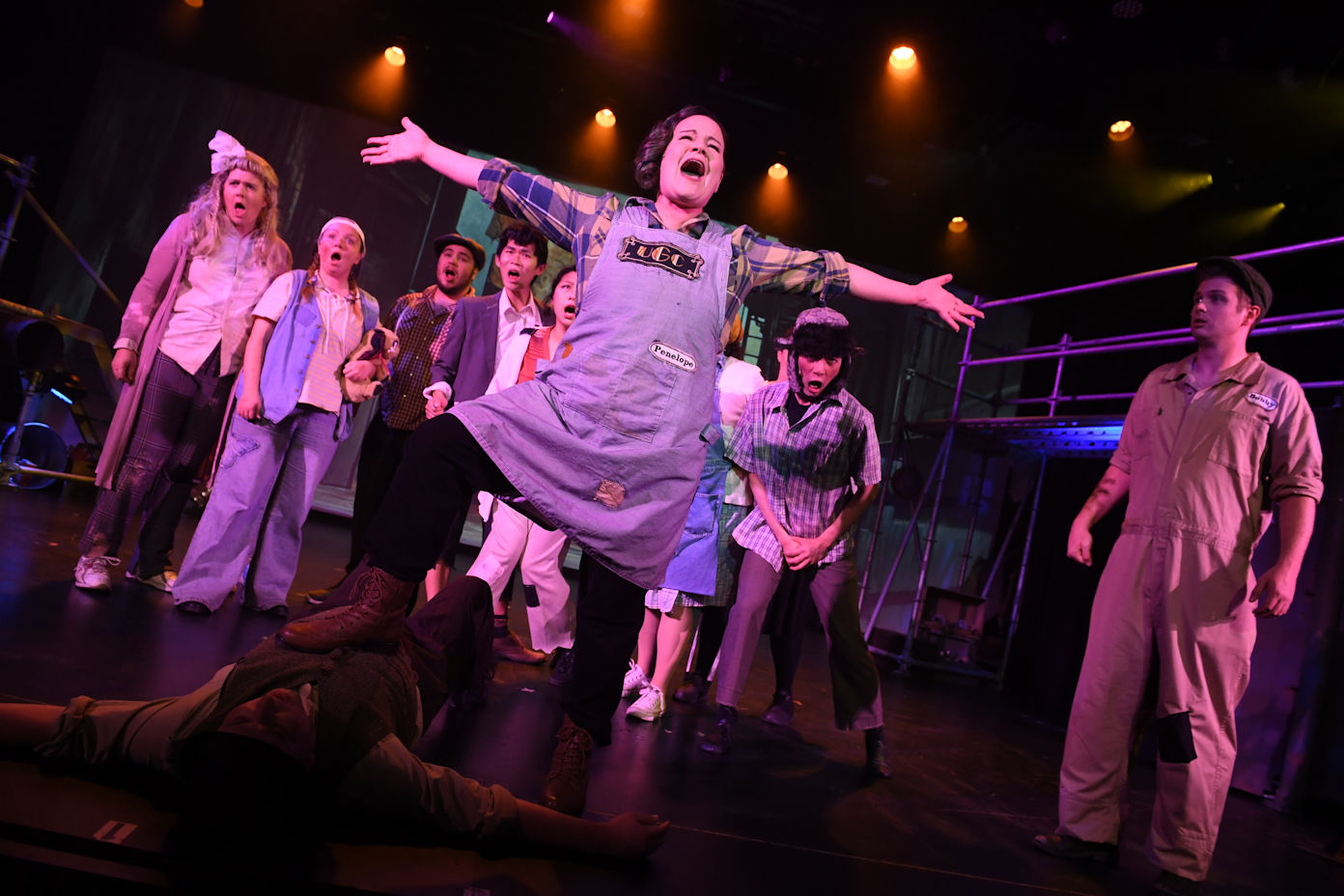 2 girls showing the meat they're selling